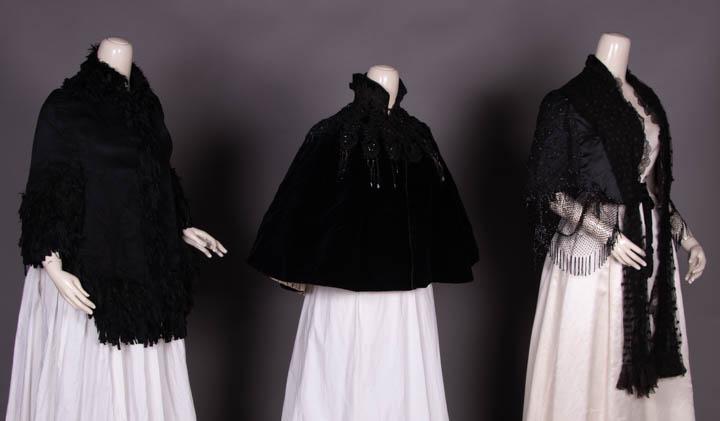 FIVE CAPELETS OR JACKETS, 1880-1890s: 1 black silk velvet caplet w/ passementerie & beading, chine silk lining, SH-SH 18”, L 22.5”, (bead disease/loss, wear especially at SH, lining damaged); 1 silk satin w/ beaded net overlay