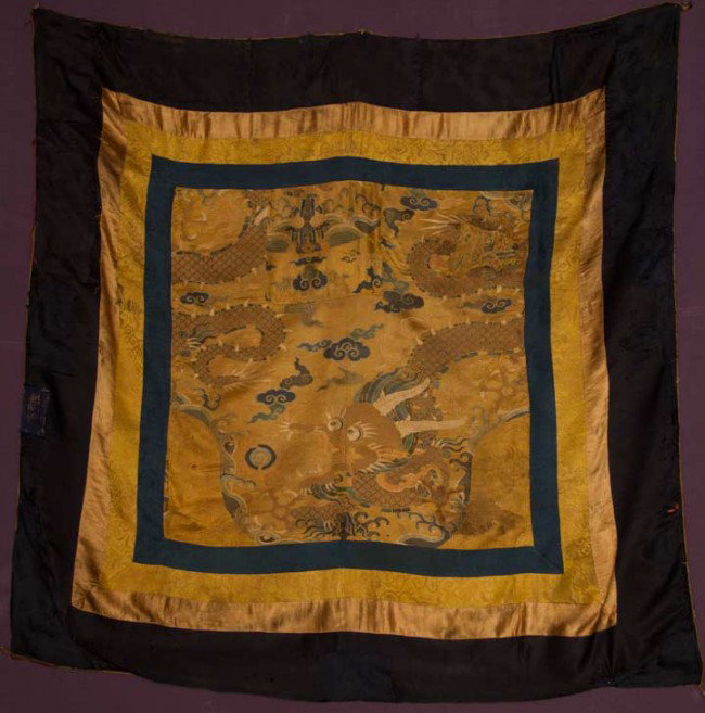 SILK BROCADE CANOPY COVER, TIBET, 1600-1630: Made in China for Tibet, gold silk damask ground, gold, blue & ivory dragon w/ tricolor underbelly & Buddhist iconography, 4 borders in shades of blue & gold, 53" x 53", (2 large patched repairs in br