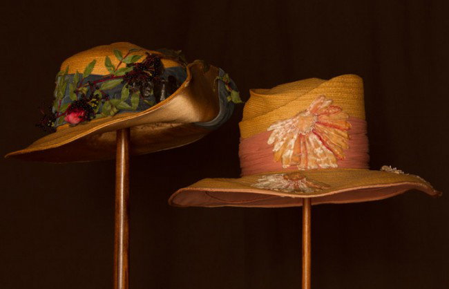 TWO LADIES' WIDE BRIM STRAW HATS, c. 1915: Both braided leghorn straw: 1 w/ upturned back brim, crown trimmed w/ teal velvet ribbon, berries & cloth roses, Wd 15.5"; 1 w/ spiral crown, dusty rose chiffon band, ombre pink to cream velvet flower