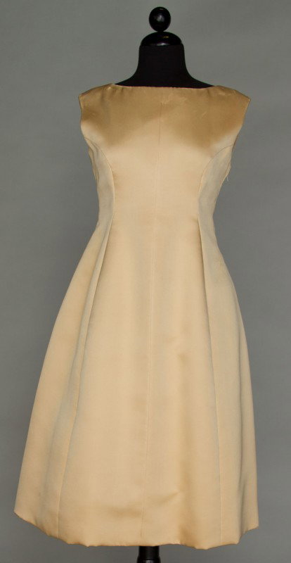 GIVENCHY COUTURE COCKTAIL DRESS, 1955: Pale banana yellow silk twill, sleeveless, semi-fitted, couture label, excellent; t/w 1 1958 red satin brocade w/ gold & jewel color Persian design, spaghetti strap, V bodice & 1 1948 navy silk faille