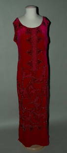 BEADED VELVET EVENING DRESS, ADAIR, FRANCE, 1920: Vibrant fuchsia long column, beaded all over w/ stylized fan shapes in black & silver glass beads & silver balls, label "House of Adair Paris New York London", B 33", H 38", L 52", (minor bead loss)