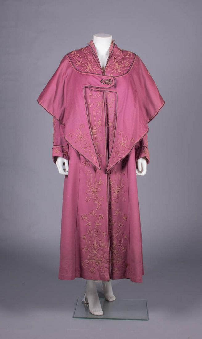 SOUTACHE EMBELLISHED BROADCLOTH COAT, 1910s: 1 mauve rose broadcloth coat w/ peach & black soutache cord in scrolling floral motifs to collar, neckline, down CF, cuffs & broad attached SH capelet w/ CF tabbed closure & deep cut-away tails CF & C