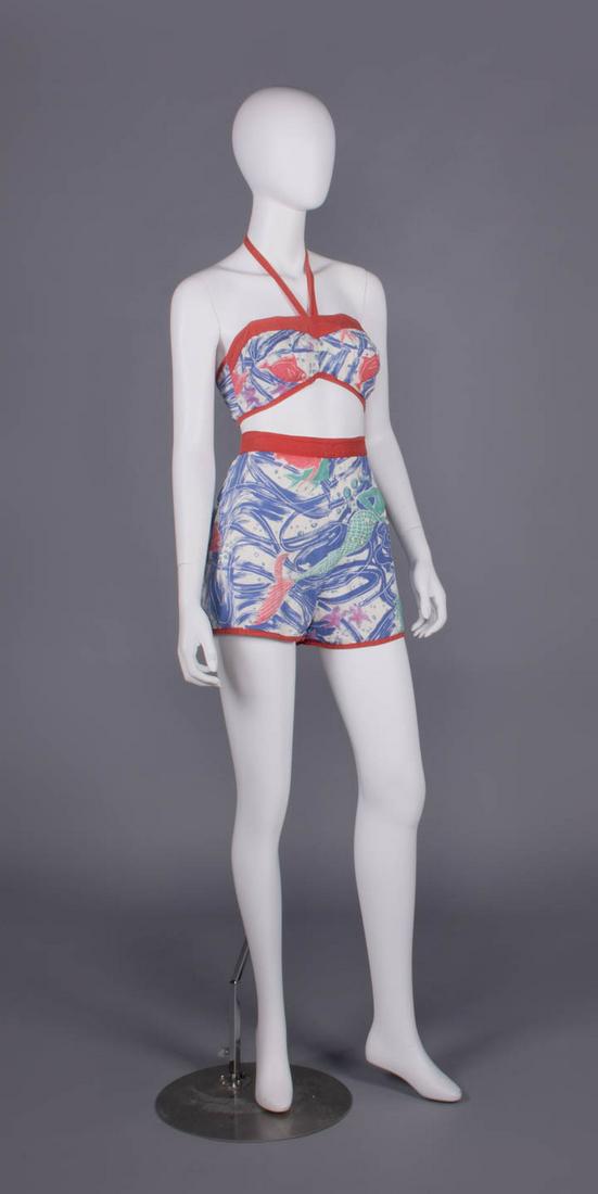 TIANA PITTELLE BATHING SUIT, HONOLULU, LATE 1940s: Printed cotton bathing suit c/o bandeau top & high waisted shorts w/ red cotton trim & halter necktie, shell embellished & kapok stuffed mermaid motif to shorts, label "Tiana Pittelle Fashion, Origina