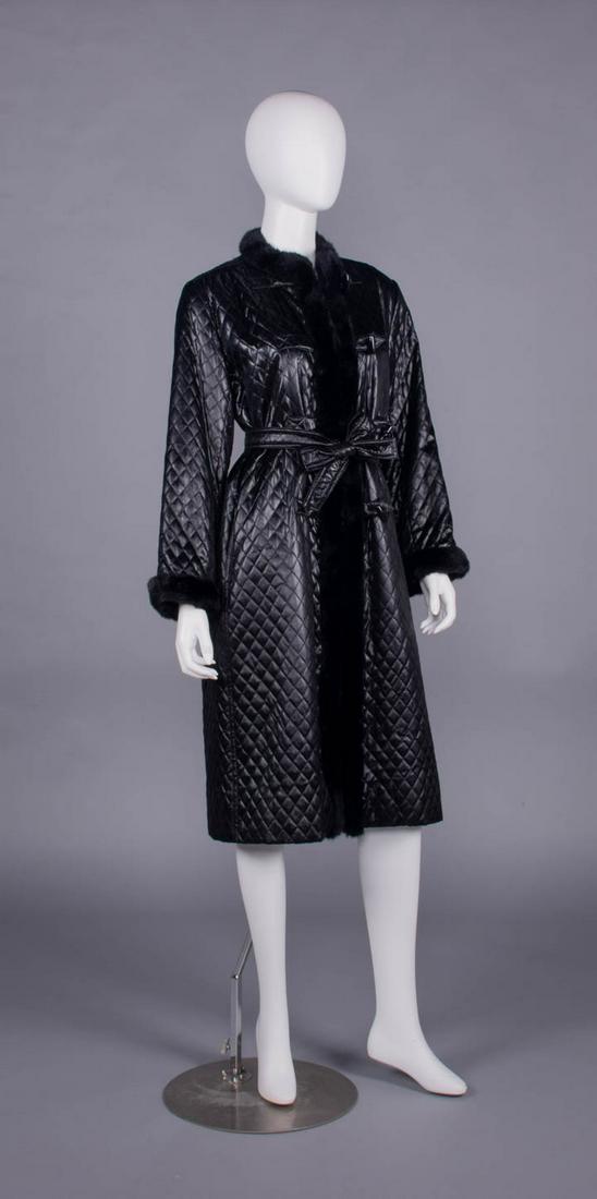 GIVENCHY QUILTED SILK COAT, PARIS, 1970s-1980s: Black glazed cotton coat quilted in diamond pattern w/ tie self-belt, faux fur collar, CF opening & cuffs, inserted tab closure w/ composite barrel buttons, label "Boutique Givenchy Paris", B 44", L 4