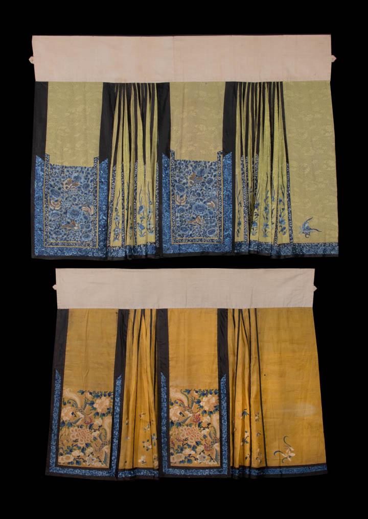 TWO PAIRED MANDARIN SKIRTS, CHINA, LATE 19TH C: 1 chartreuse patterned paired skirt front & back panels embroidered in blue ombre silk floss in chrysanthemum & floral motifs w/ butterflies in shades of brown, blue & cream, pleated side panels w/ vi