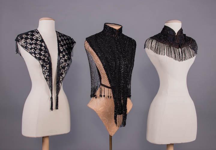 BEADED CAPELETS & MANTLE, 1880-1890s: 1 w/ deep V checkerboard front in black sequins & beads w/ tassels at each terminus, bugle beaded bands at neckline, outer edge & center, vermicelli & leaf motif in short bugle beaded V to CB, long be