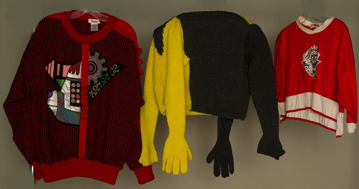 THREE DESIGNER TOPS, 1980s: 2 w/ Yoshi Yammamoto's "Kansai" labels: 1 red & black stripe wool knit sweater w/ colorful CF applique, b 50", l 28", 1 red, white cropped T-shirt w/ applied design of winged angels, shield & text "Ka