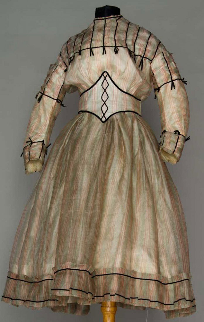 LITTLE GIRL'S SILK PARTY DRESS, c. 1865: Transparent silk gauze w/ red, black & white stripes, 3-piece dress, blouse, button-on skirt & Swiss waist, all trimmed in very narrow black velvet ribbon, W 20", L 37", (grey tinge) very good; t/w 1