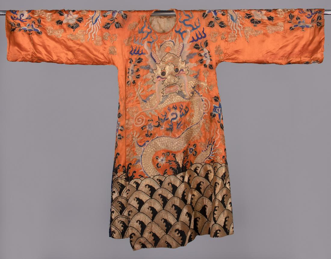 PEKING OPERA COSTUME, CHINA, LATE 19TH C: Orange silk satin embroidered in metallic & silk thread, lined w/ linen, B 46", L 48", (blue dye bleeding, wear/pulls to cording, stains/discoloration, shattering & 2.5" holes at underarms, 3" seam op