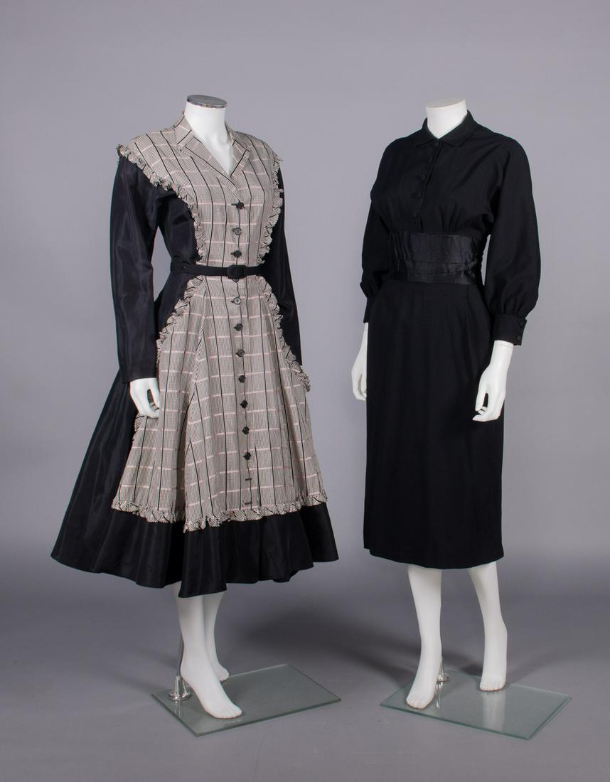 TRAINA-NORELL & DESSES LICENSED COPY, AMERICA, 1950s: 1 black synthetic long sleeve day dress w/ pink & black window check plaid applied apron front w/ self-ruffle edging into back yoke, CF button closures & black fabric covered belt, label "A Jean Desse
