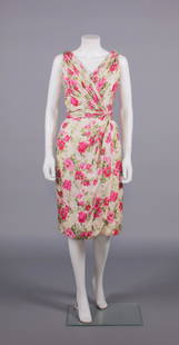 CEIL CHAPMAN PRINTED SILK PARTY DRESS, AMERICA, 1950s: Printed silk twill faux wrap party dress printed in pink rose & green foliate motifs w/ gathered & pleated crossover bodice & W band into twist at left W & continuing into faux wrap front skirt panel,