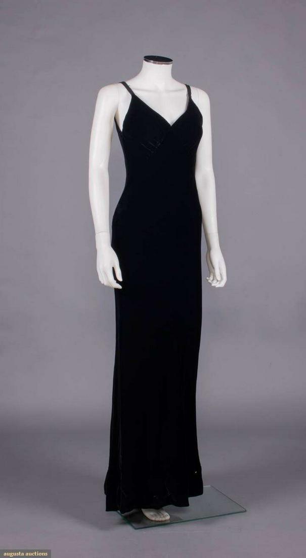 BARBARA MATERA FOR CANDICE BERGEN EVENING DRESS, NEW YORK, 1980s: Black velvet bias cut evening dress w/ slender SH straps, V-neckline w/ gathered diagonal under bust meeting at V-neckline, CB zip closure, label "Barbara Matera Ltd. Miss Bergen New York", B 34", W 2