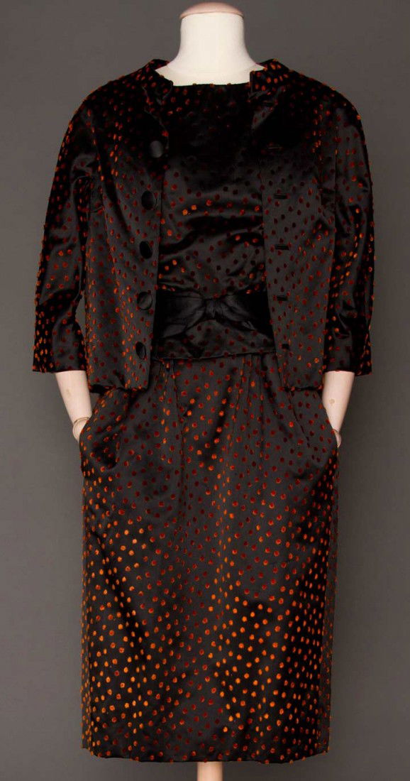 DIOR COUTURE DINNER SUIT, WINTER 1960: Black silk satin w/ rust velvet dots, boxy jacket, fitted sleeveless blouse & satin bow-belt, skirt w/ attached China silk shell, B 36", W 30", L 44", couture label stamped "106419", (satin belt's lea