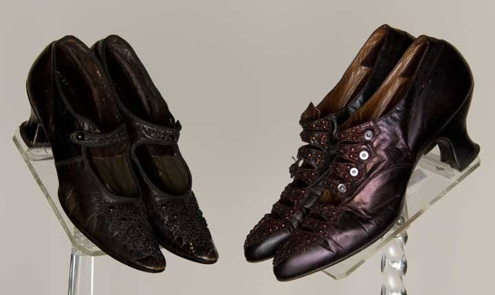 TWO PAIR BEADED SHOES, 1900-1910: Both embroidered leather w/ low Louis heels: 1 black Mary Jane, vamp & strap w/ jet beads, L 10.25", (small leather cracks) very good; 1 pair irridescent aubergine, vamp & 5 front straps w/ copper car