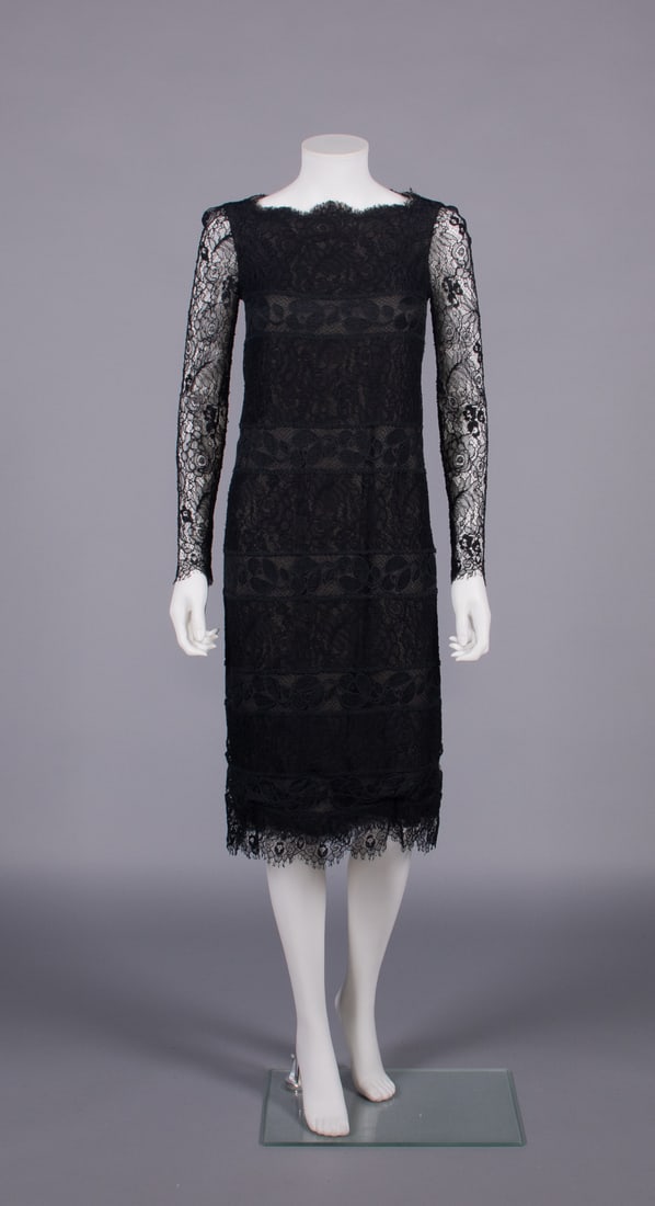 COUTURE CHANEL SILK & LACE COCKTAIL DRESS, PARIS, 1980s: Cocktail dress of black silk & linen cutwork guipure floral lace horizontal bands interspersed w/ re-embroidered modern chantilly, full length fitted sleeves, scalloped neckline & hem, underdress of s