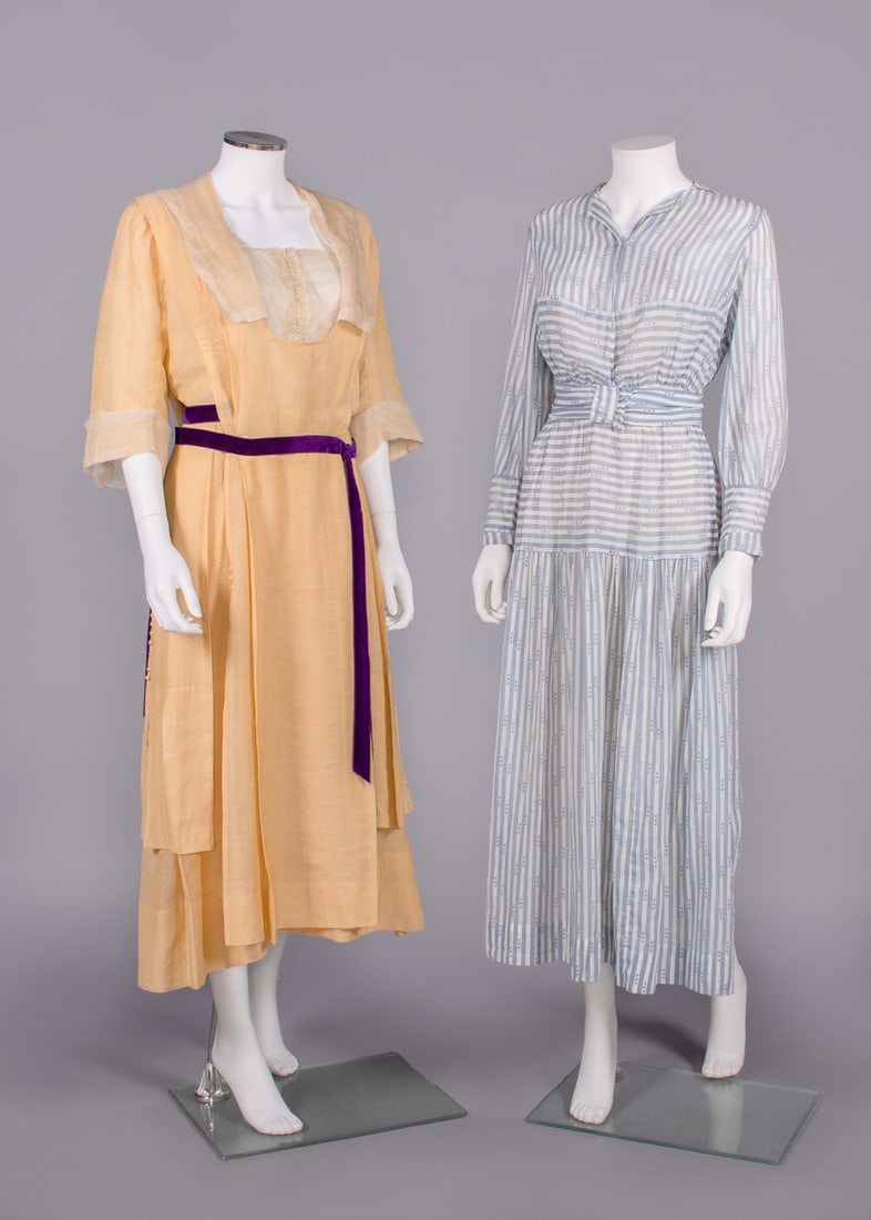 TWO COTTON OR SILK DAY DRESSES, 1913-1916: 1 pale yellow silk w/ collar, cuffs & front inserts in hemstitched silk organza, tabard front & back, self covered decorative button to back skirt panels, silk velvet purple ribbon at W, c. 1916, B 36
