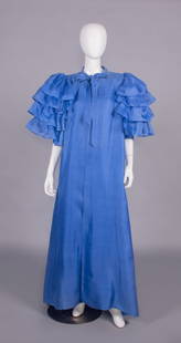 COUTURE GIVENCHY SUMMER EVENING CAPE, PARIS, S/S 1985: Royal blue silk gazar & organza evening cape w/ band collar into CF tie closure, free front, tiered SH ruffles over elbow length sleeve, label “Givenchy Made in France”, couture #79870, B