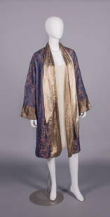 SILK LAME' EVENING COAT, 1920s: Blue, rust & lame’ evening coat w/ gold lame’ collar, CF & cuffs, lined w/ steel blue silk velvet, 1920s, B 52”, SH-SH 16”, L 44”, (many pulls, shattering at SH, tarnish to