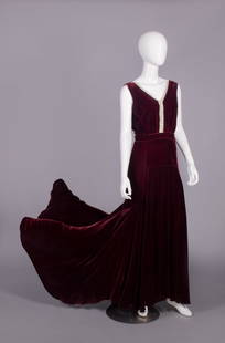 SILK VELVET & RHINESTONE EVENING GOWN, USA, 1938: Burgundy silk velvet evening gown w/ wide V- neckline accented w/ applied rhinestone band to W, plunging back neckline, attached self belt w/ Deco clasp, full trained skirt, label "Julius Garfinckel &