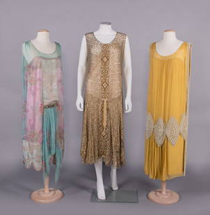 THREE SILK CHIFFON OR LAME' EVENING DRESSES, NEW YORK, c. 1924: 1 blue silk chiffon over pink silk underdress trimmed w/ gold lace, CF, hem & back panels of multicolor damask, floral & foliate motifs embroidered in beads & sequins, c. 1924, label “William Hardy