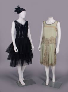 TWO SILK PARTY DRESSES, MID 1920s: 2-pc flapper ensemble c/o black silk satin dress w/ tiered silk tulle skirt, neckline & armscye edged in tulle, black silk matelasse manipulated demi-cloche w/ silver metallic short bugles & black