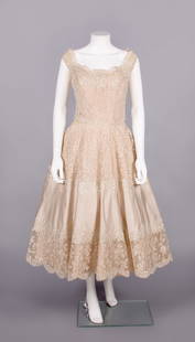 CEIL CHAPMAN PARTY DRESS, USA, 1950s: Machine lace tulle embroidered w/ iridescent sequins, champagne silk satin inserted skirt band all over blush pink taffeta w/ scoop neckline, fitted W & flared skirt, CB zip closure, label "Ceil Chapm