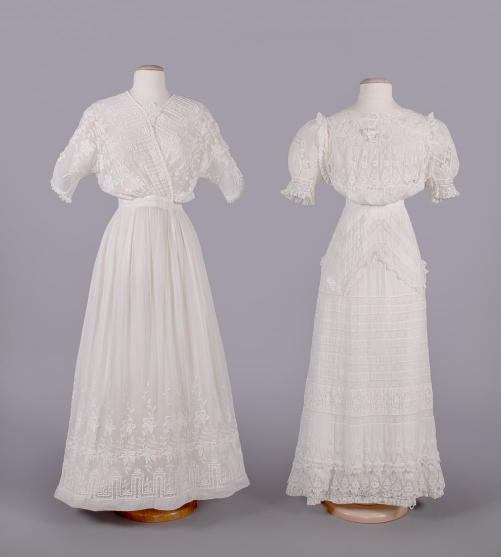 TWO COTTON LINGERIE DRESSES, c. 1906-1909: 1 cotton mull chemical lace w/ woven lace insertions, B 36", W 22", L 53", (2 small stains lower skirt & seat, 1.25" seam opening left bodice ruffle, few loose threads, few tiny holes) excellent; 1 co