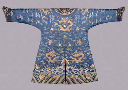 BLUE SILK EMBROIDERED DRAGON ROBE, CHINA, 1870-1900: Blue silk dragon robe w/ silk embroidered & couched metallic thread depicting dragons & auspicious symbols over mountain & wave motif, brass ball button closures, CH 50&rdquo;, L 40&rdquo;, (small tea