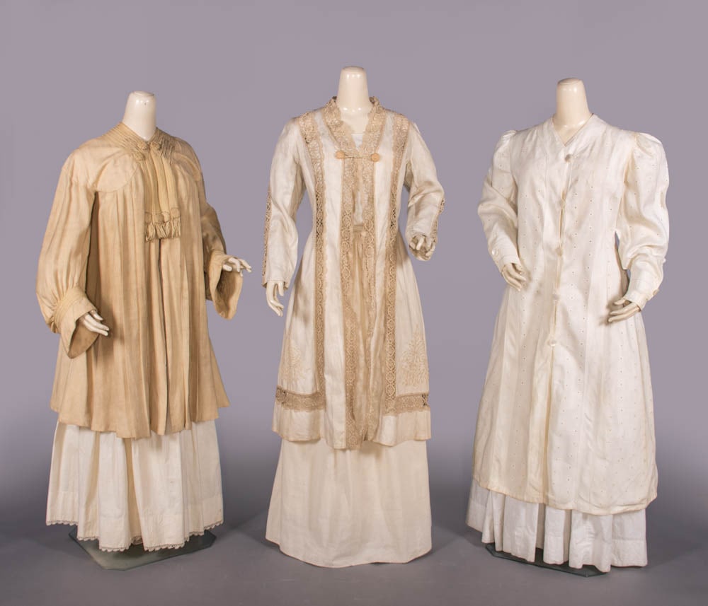THREE LINEN COATS OR DUSTERS, 1905-1910: 1 heavy ecru linen summer coat w/ soutache trim, bishop sleeve, linen & soutache buttons, c. 1905, SH-SH 21”, B 36”, L 39”, (wear/minor discoloration at collar, broad light discolora
