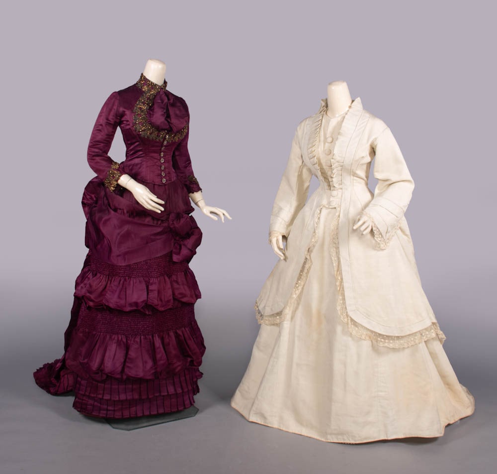 TWO SILK AFTERNOON OR VISITING DRESSES, BOSTON, c. 1870 & 1880s: 2-pc purple ribbed silk w/ jet & faceted metallic beaded passementerie to standing collar, B & cuff, CF carved & beaded MOP buttons, trained bustle skirt, 1880s, w/ “petersham label “...Partridge,