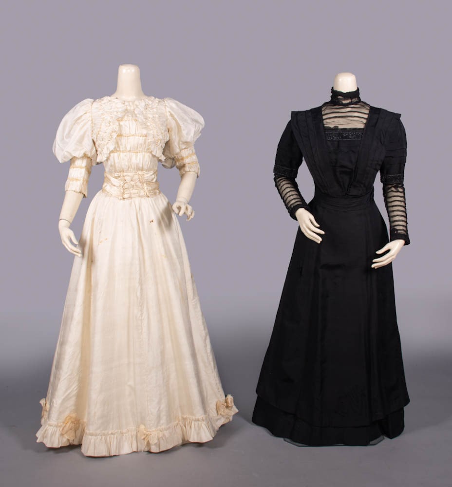 TWO SILK EVENING OR AFTERNOON DRESSES, LATE 1890-c. 1910: 1 bone china silk gown w/ faux pearl embroidered bands over gathering to CF & cuffs, broad self W band w/ thread-covered hoops to CF, skirt w/ self ruffle flounce & ecru faux moire' bows, late 1890s, 