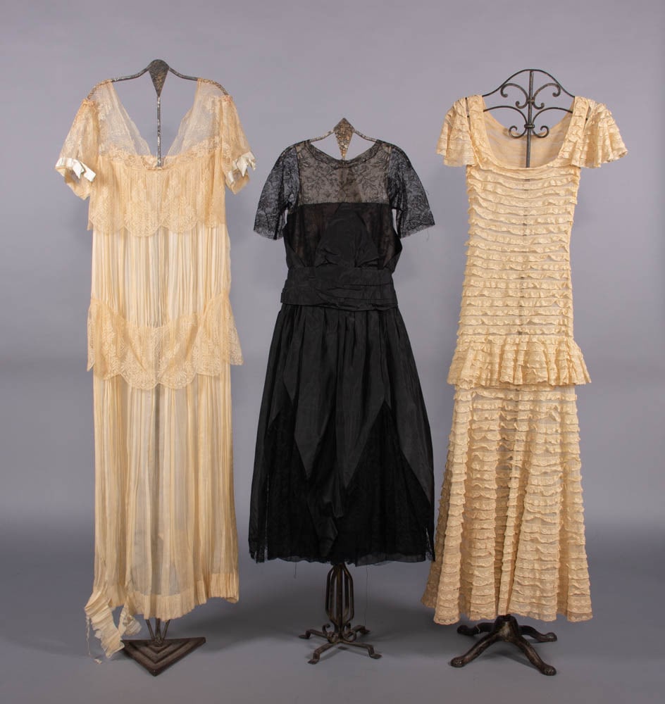 ONE LINGERIE & TWO EVENING DRESSES, USA, 1916-1930s: 1 lingerie dress of off-white pleated silk trimmed w/ lace ruffles & pale blue satin ribbon, early 1920s, fair; 1 evening dress of black silk taffeta, black lace & nude net, label “Harry Collins, Ne