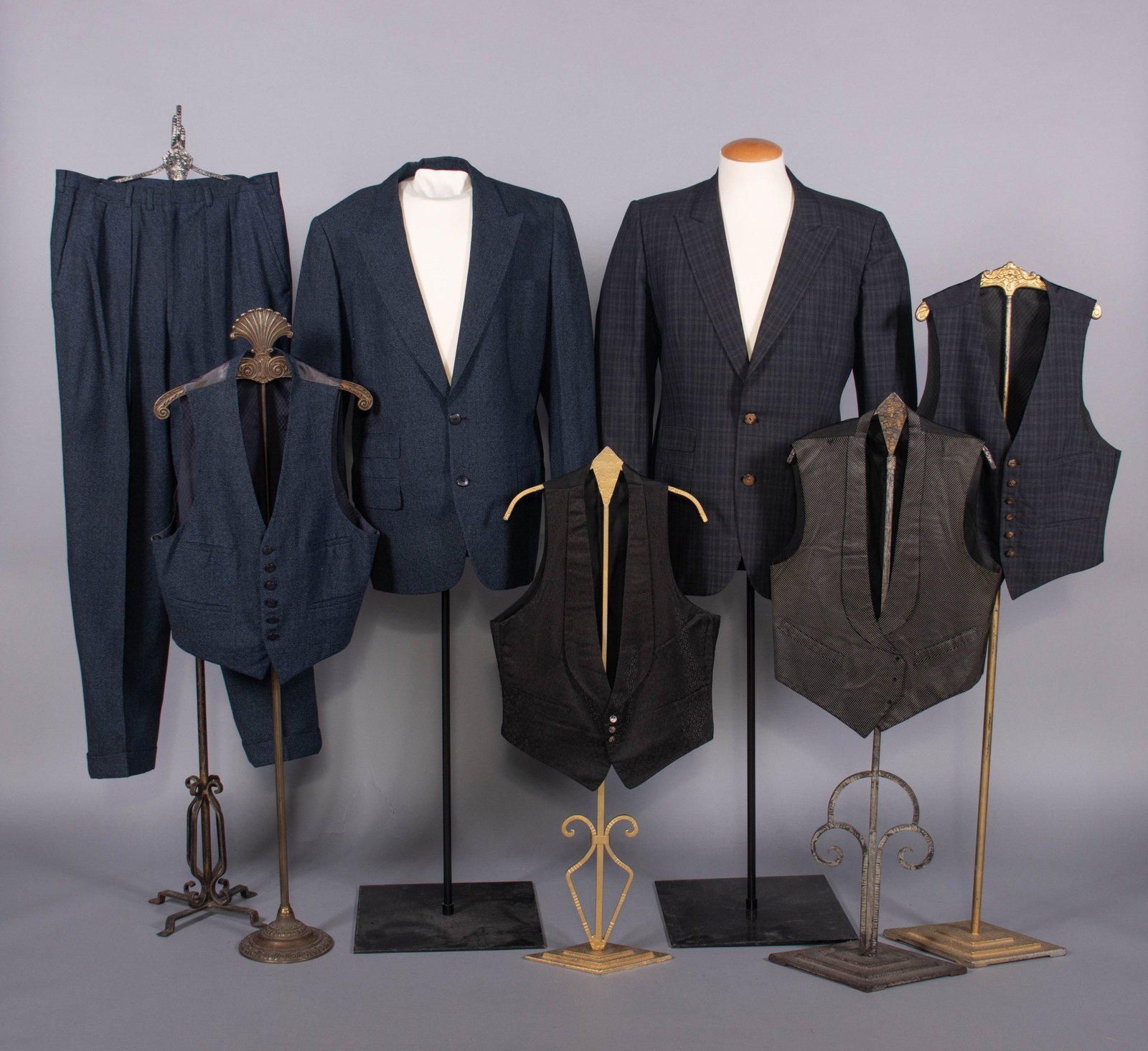 COLLECTION OF MENSWEAR, CHICAGO, 1910-1955: 3-pc suit of dark blue & grey circle patterned wool w/ black composition buttons, lined w/ dark blue patterned rayon, label “Spencer, Chicago”, dated December 2, 1955; 2-pc jacket & waistcoat 