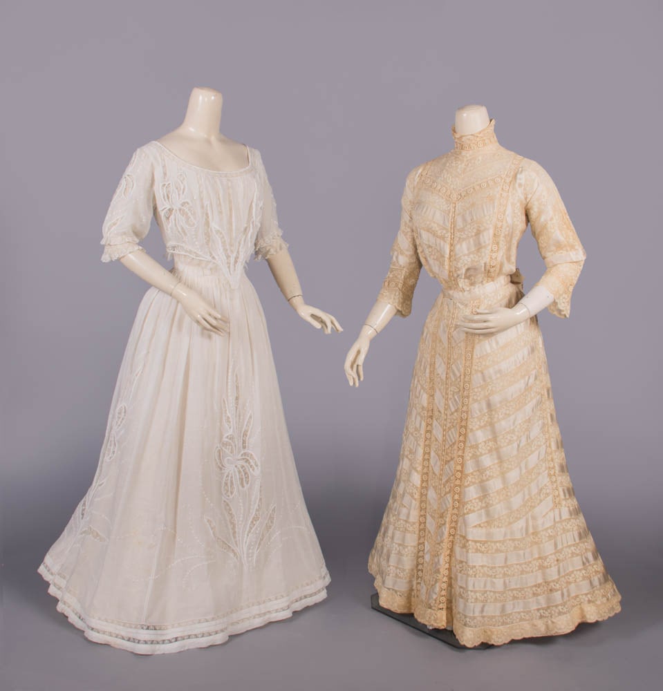 COTTON MULL OR SILK LINGERIE DRESSES, 1900-1908: 1 white cotton mull hand embroidered in Iris motifs w/ mm lace insertions, label “...Anderson…[illegible], Fifth Avenue New York” B 32”, W 22”, L 54”, (slip N/I); 1 silk & 