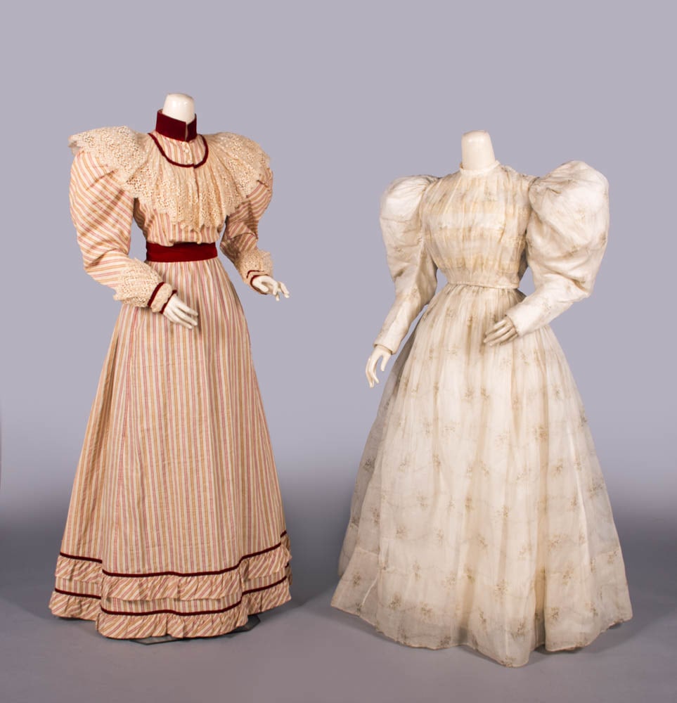 TWO COTTON AFTERNOON DRESSES, c. 1895: 2-pc afternoon dress of white cotton w/ wine & brown seersucker warp stripe, wine silk velvet collar & applied bands to W, cuff & hem, chemical lace pelerine yoke ruffle & cuff, B 34”, L 16&rdqu