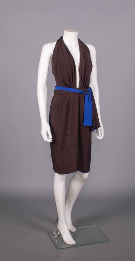 ANDREA ODICINI SILK COCKTAIL DRESS, ITALY, LATE 20TH C: Chocolate brown fine twill cocktail dress lined w/ sapphire blue silk crepe w/ plunging front neckline into halter back looped through back strap, reversible waist sash, front left H snap closures, la