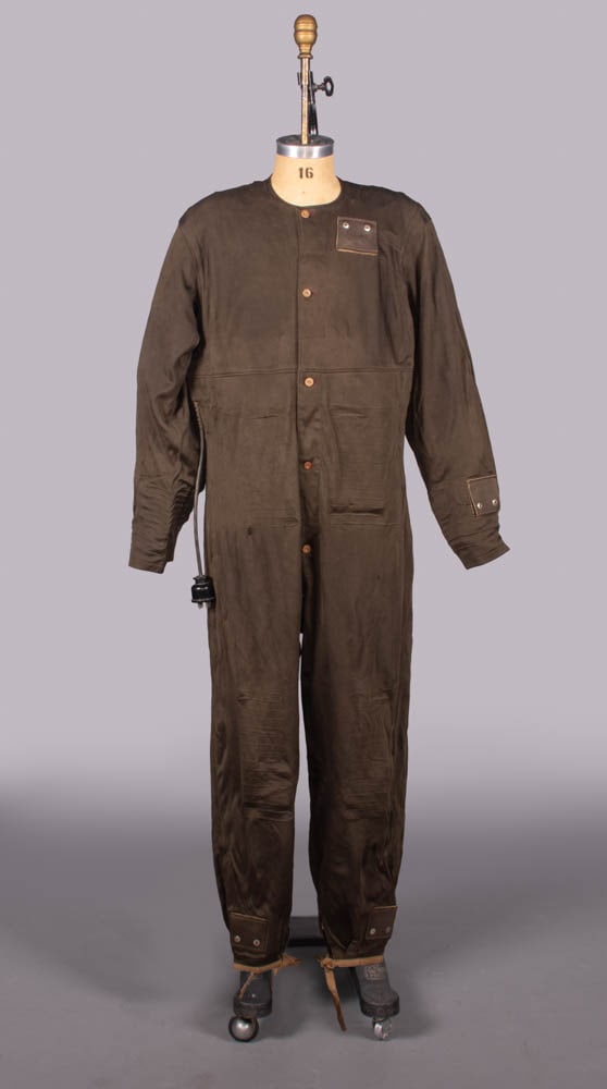 JAPANESE ELECTRIFIED AVIATION SUIT, WWII: WWII Japanese silk flight suit of double knitted silk w/ inserted electrical heating elements to SHs, sleeve cuffs, back & midriff, ramie facings, Japanese inspection label from 1947 w/ manufacturer �