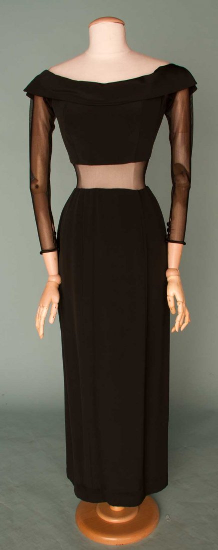 VERA WANG EVENING GOWN, 1990-2000: Black silk jersey, draped F collar, long sheer net sleeves & midriff insertion, labeled & marked size 6, excellent.