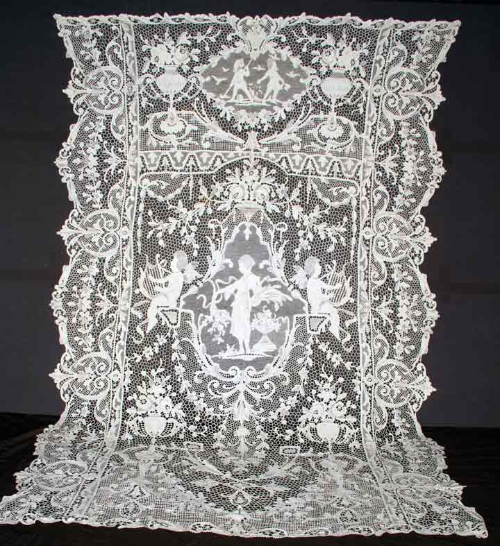 VENETIAN TAPE & NEEDLE LACE CLOTH, 1900-1920: Finely worked tape lace, flowers, trailing vines & cartouches surround needlelace floral bands & oval bouquets w/ center medallion of female figure surrounded by floral garlands, 80" x 102", (small da
