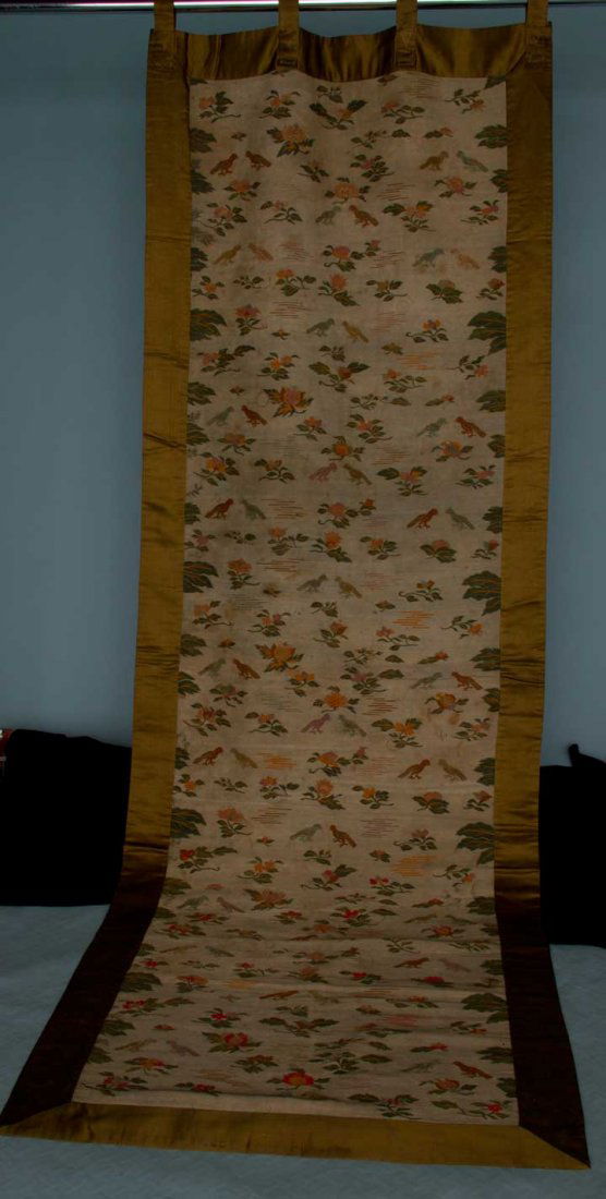 TAPESTRY WALL HANGING, CHINA, 19TH C: Tapestry woven linen, grey ground w/ multi-colored bird & flower motifs, ochre satin border, plaid lining, 33.5" x 99.3", (discolored due to soiling & some stains, 1" break near top edge) very good.