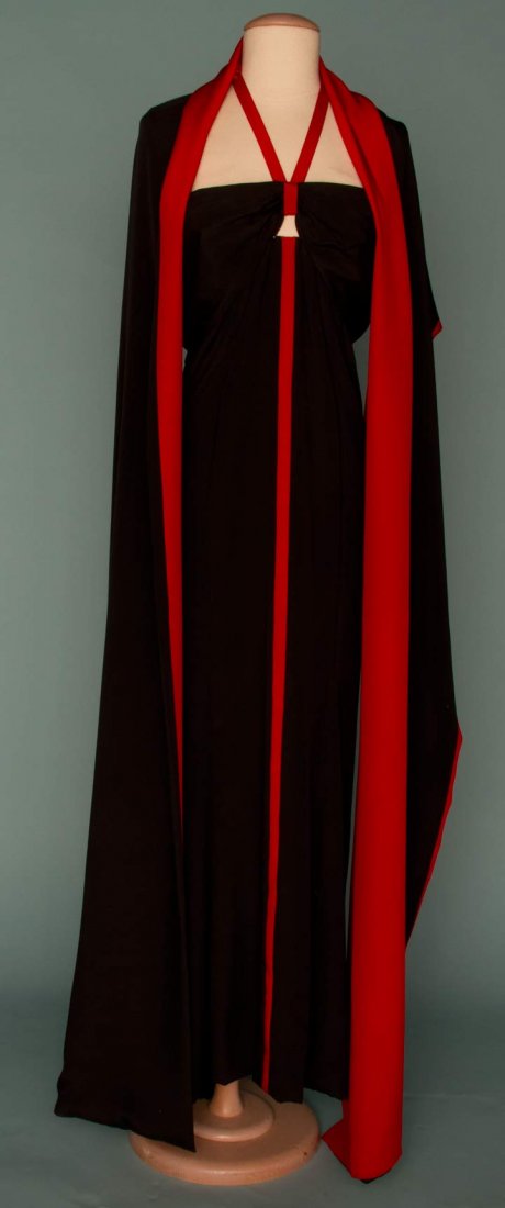 TRIGERE HALTER EVENING GOWN, 1986: Black silk sheath, red center stripe & halter, matching long black & red stole, B 38", H 38", L 56", (unlabeled); t/w 1 black cut velvet cocktail dress, black fox fur trim & belt, excellent.