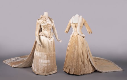 TWO TRAINED WINTER EVENING OR WEDDING GOWNS, 1884-1888