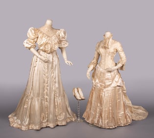 TWO CREAM SILK TEA OR WEDDING GOWNS, c. 1883 & c. 1908
