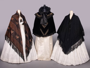 THREE SILK, VELVET OR EMBROIDERED WOOL CAPES, 1860-1870 & c. 1893