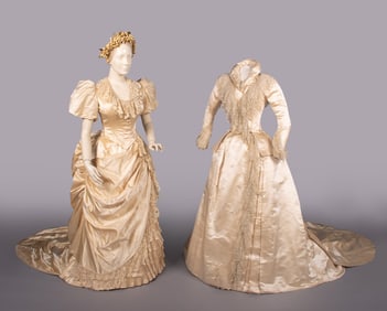 TWO SILK SATIN WEDDING GOWNS, c. 1880 & c. 1883
