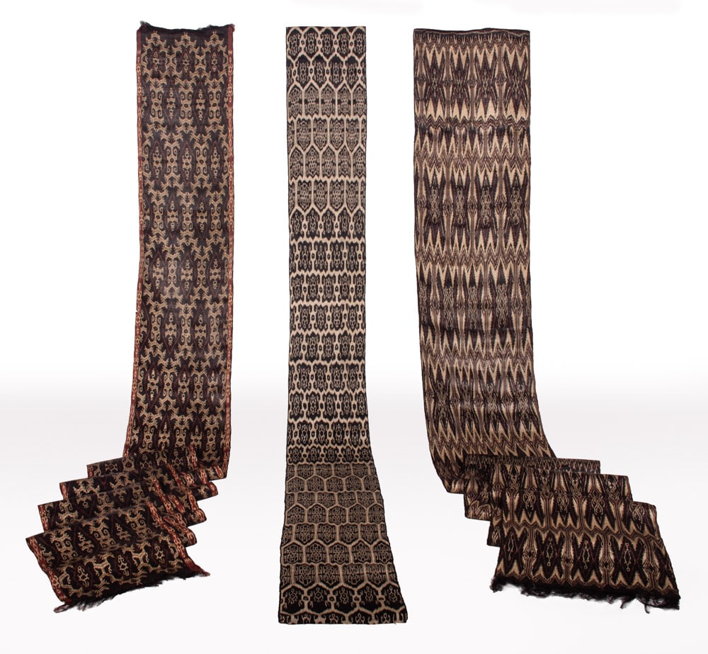T'NALAK YARDAGE, PHILIPPINES, 1980s: T'nalak cloth made from manila hemp (aka abaca fiber) derived from banana plant, Philippines, c. 1980s: 1 white/red on black w/ red border, 19” x 248”, (0.75”-1.5” tears at bor