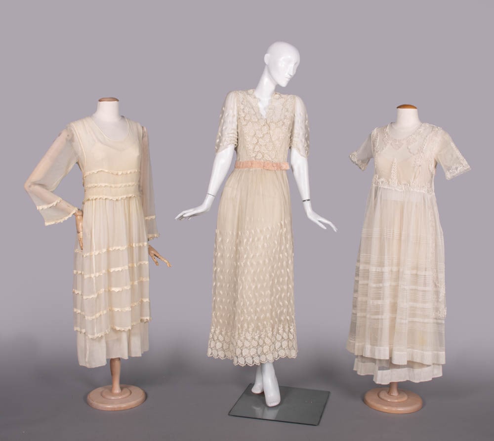THREE TULLE OR CREPE LINGERIE DRESSES, 1912-1917: 1 cream silk crepe dress w/ scoop neck, china silk triangular inserted rows at W, around skirt & cuff, self crepe bow at CB, self lined underskirt, c. 1917, B 32”, W 26”, L 48”, (sha