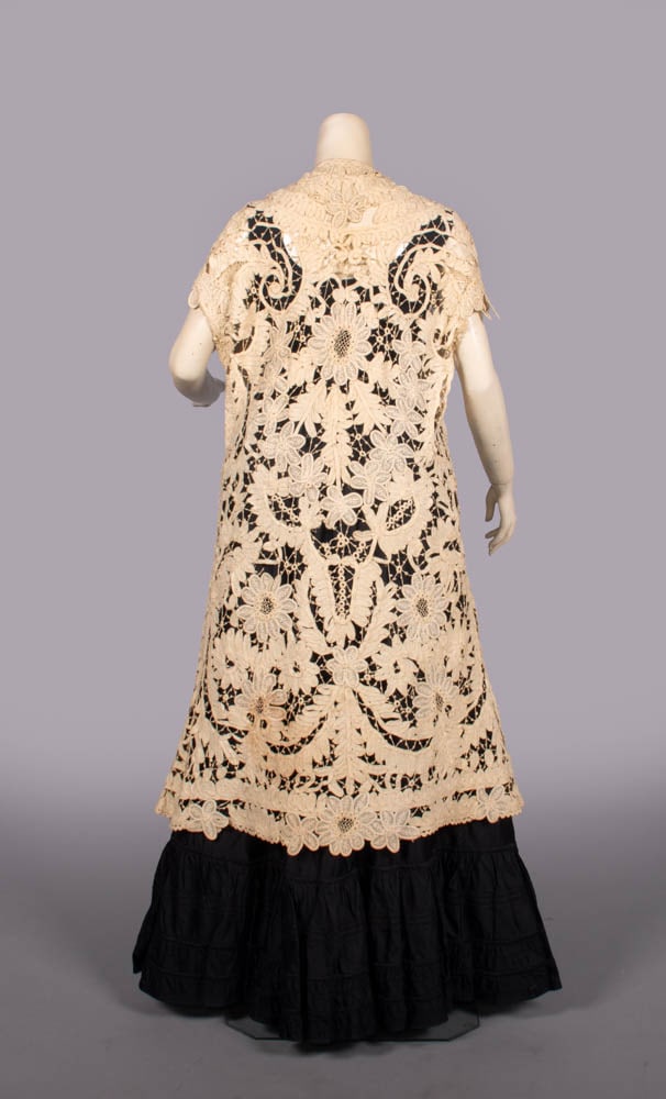 TAPE LACE VEST, 1910s: Tape lace vest w/ free front, B 40", L 42", (slip N/I, broad discoloration, several broken brides, fraying at armscyes-sleeves likely removed, small thread pulls, broad light wear) Fair-good.