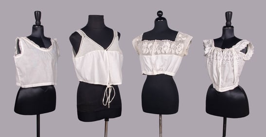 FOUR WHITE COTTON CORSET COVERS OR CAMISOLES, EARLY 20TH C