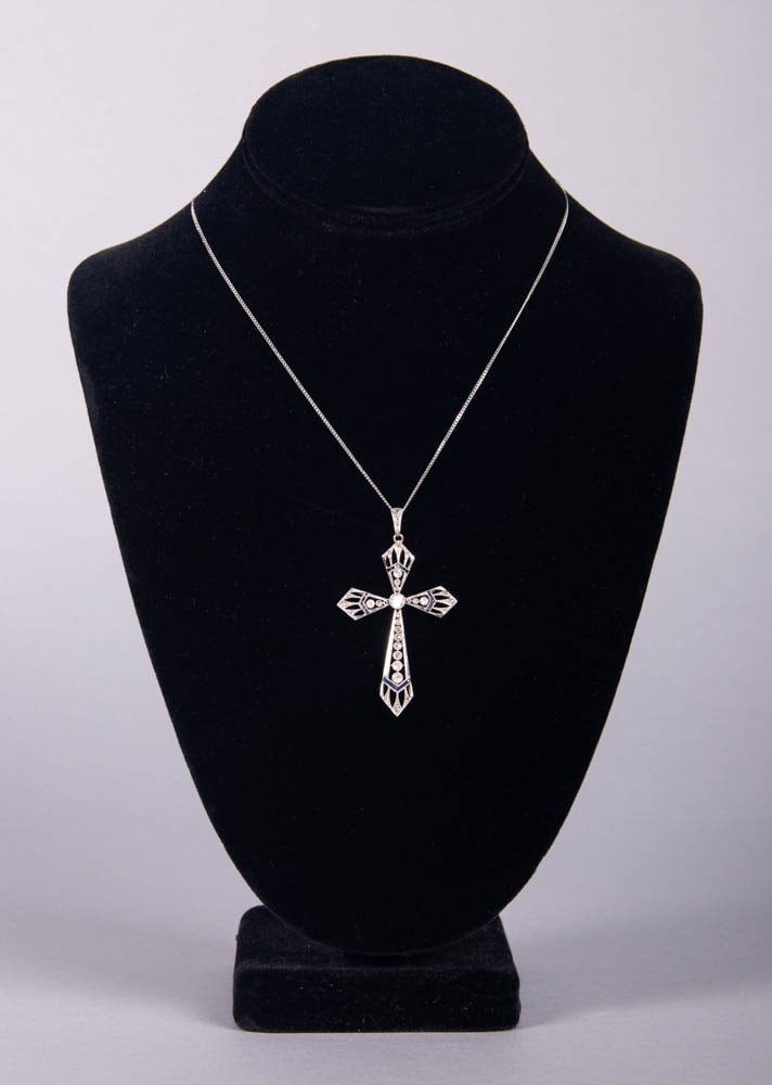DIAMOND & SAPPHIRE SET PLATINUM CROSS PENDANT, EARLY 20TH C: Platinum & yellow gold cross pendant set w/ single cut up to 3.8 mm diamonds & sapphire baguettes, on 16” white gold chain stamped “750”, clasp replaced w/ magnetic barrel, 10.6 g total 
